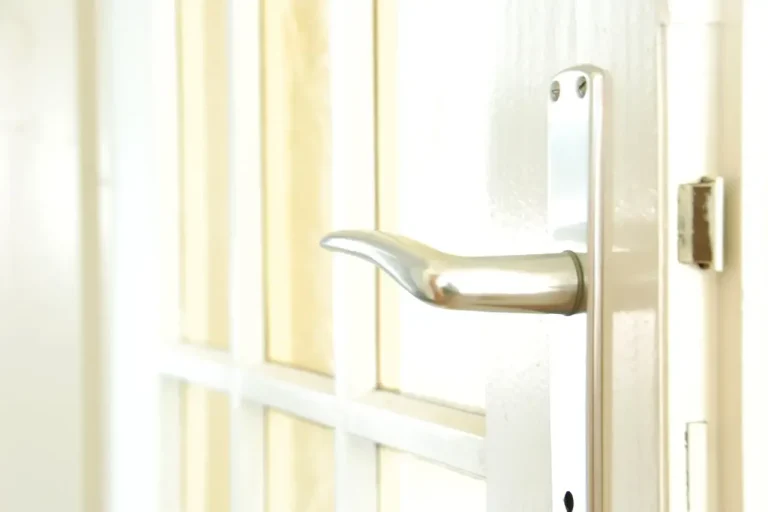Lock repair or replacement in Lancing – white door with a lever handle and locking plate, Locksmith Lancing guide to which your door needs