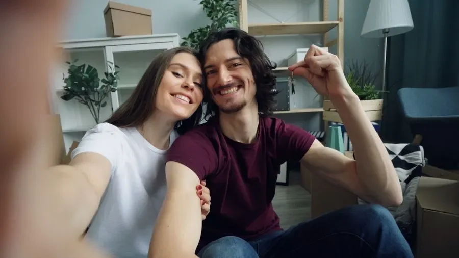 Couple holding up keys in their new home – residential locksmith Lancing help for homeowners from Locksmith Lancing