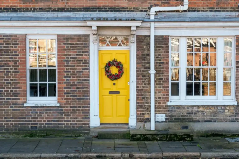 Types of door locks in the UK – yellow front door on a red-brick Victorian house in Lancing, Locksmith Lancing guide to identifying your lock